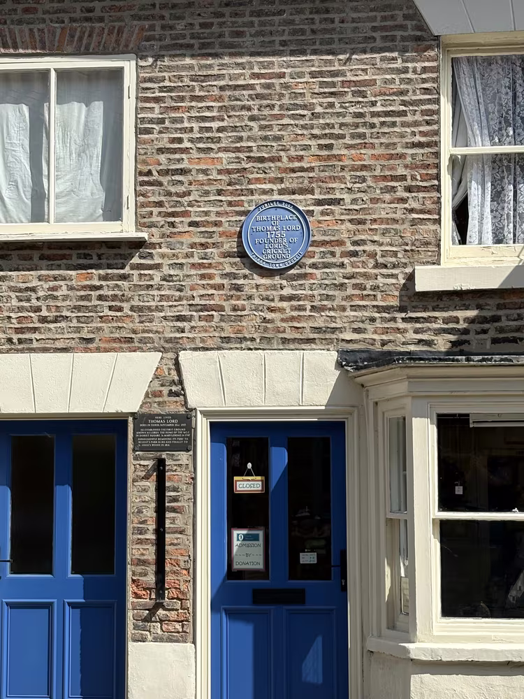 The blue and black Thomas Lord plaques together