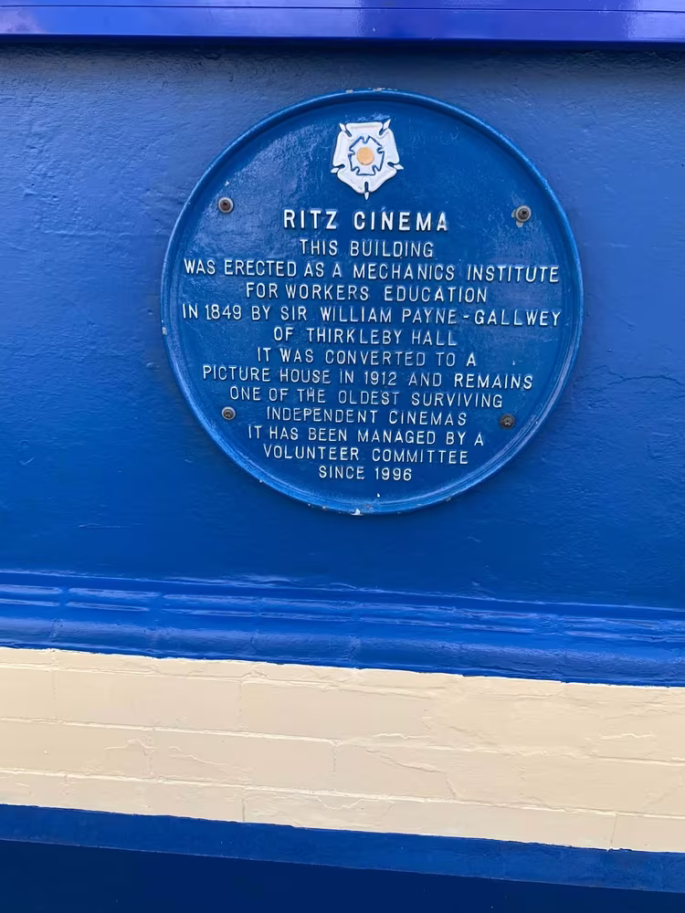 The blue plaque, recording the building as the Mechanics Institute