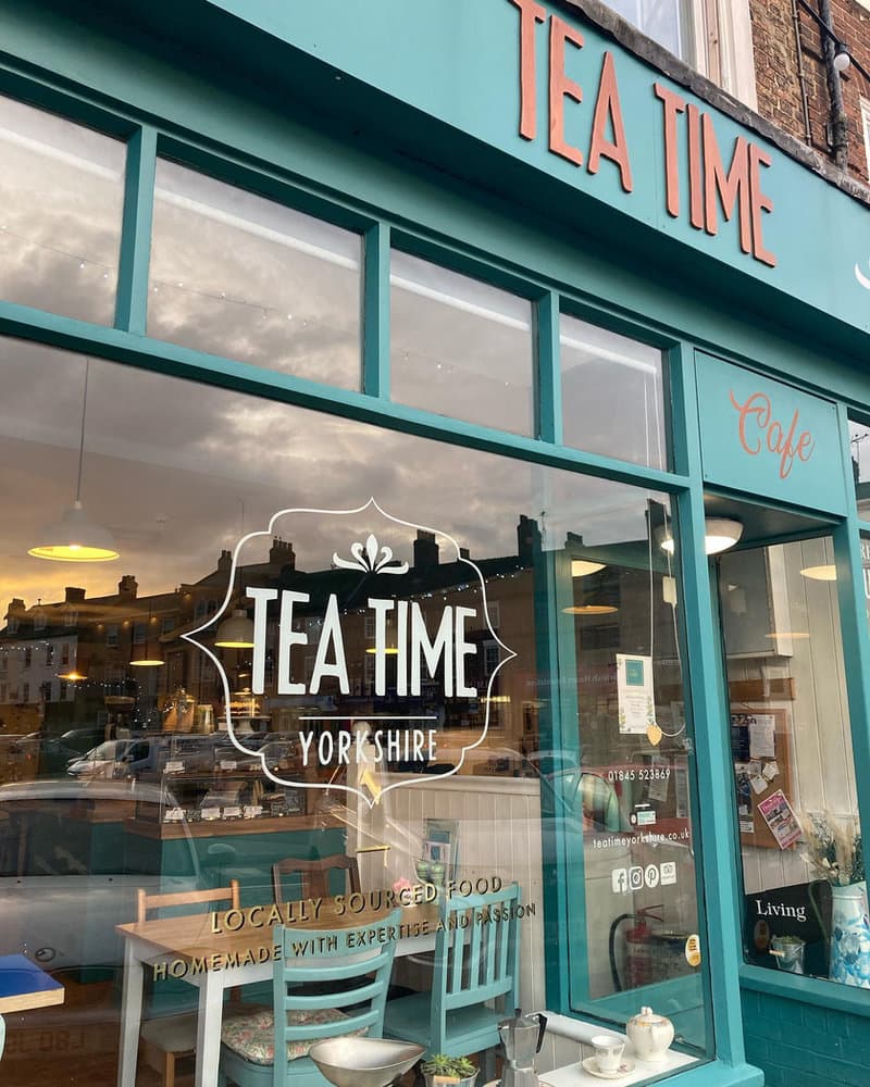 A pot of tea served in mismatched vintage china at Tea Time Cafe