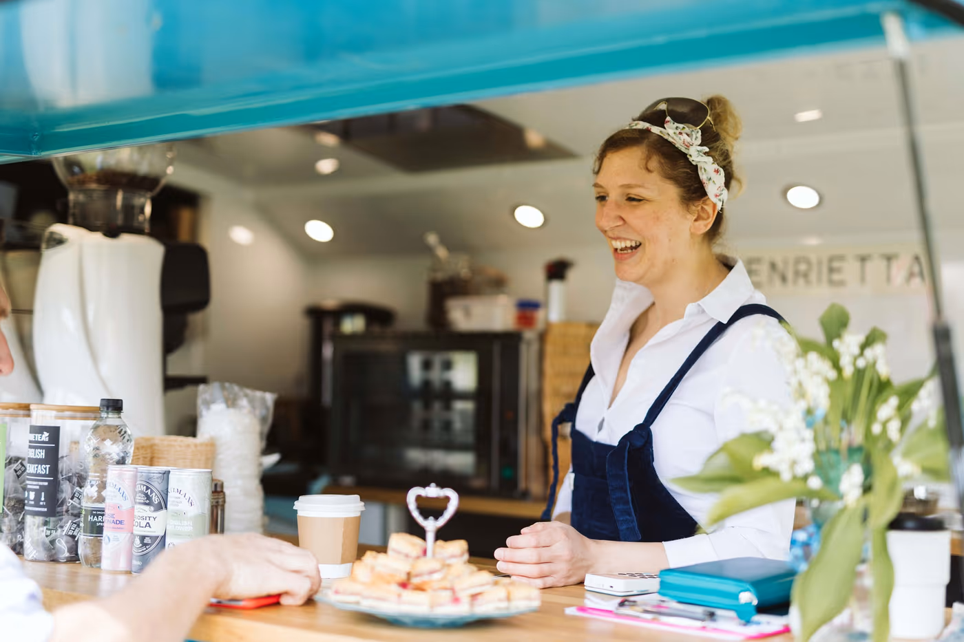 Rosa at the serving hatch inside Henrietta, the 1967 Citroen H van